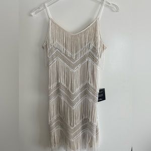Stunning fringe mini! Never worn!